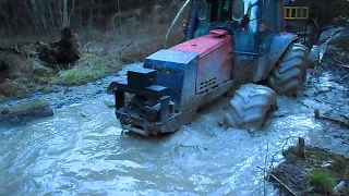 Valtra forestry tractor in wet forest , difficult conditions