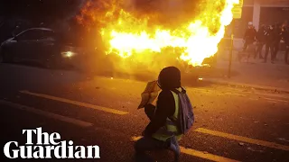 Vehicles set alight as thousands protest against police violence in Paris