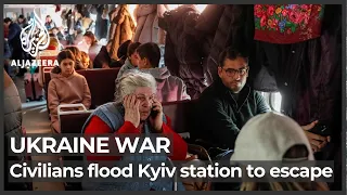 Ukraine war: Ukrainians flood Kyiv train station to escape