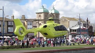 Air Ambulance Helicopter Takeoff from Seafront at Great Yarmouth and Lifts off Backwards