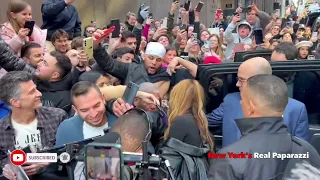 Shakira walks through hundreds of fans in New York.