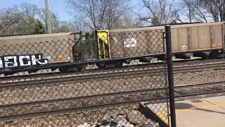 BNSF 6307 Leading Coal train and stopping at Fridley MN Northstar Station.