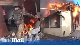 Ukraine soldiers flee a burning building whilst surviving heavy shelling in Bakhmut