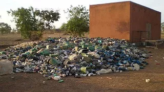 Women in South Africa recycle bottles to make gift boxes and fancy holders [no comment]