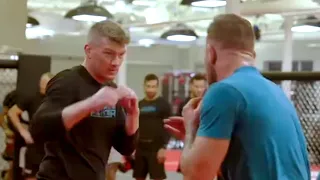 Conor McGregor demonstrates punch on Stephen Thompson
