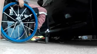 Quadriplegic transfer into Porsche