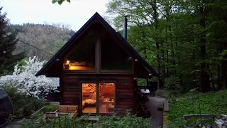 Carrying all the luggage across the 1°C river to reach the cabin in the woods.