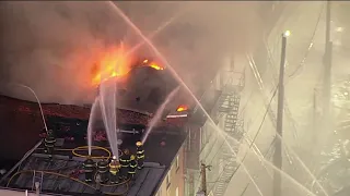 100 firefighters battle massive building fire in North Philly