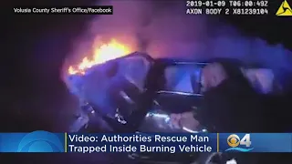Dramatic Video Shows Florida Officers Rescue Man From Burning Car