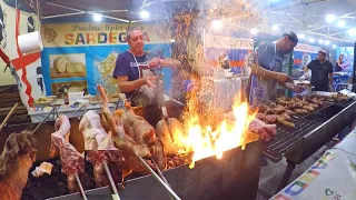 Italian Masters Roasts Huge Grills of Pork Meat. Italy Street Food from Sardinia