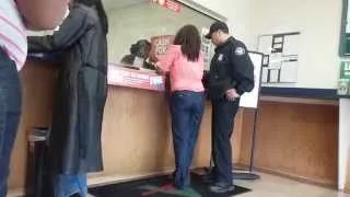 How To Get Arrested, Lady gets arrested for check fraud at a check cashing store.