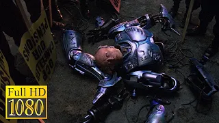 Bandits cut Alex Murphy into pieces in the movie RoboCop 2 (1990)