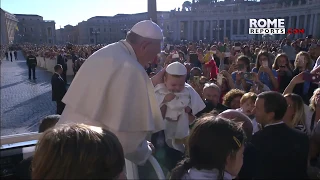 A baby dressed as the pope surprises Pope Francis