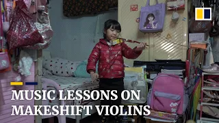 Pencils and a tea box: makeshift ‘violins’ help underprivileged music students during the pandemic