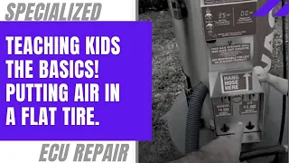 Teaching kids the basics! Putting air in a flat tire.