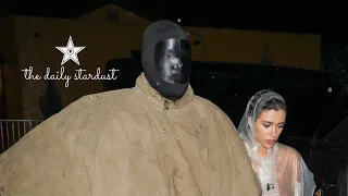 Ye & Wife Bianca Censori Brave The Rain With See Through Rain Coat And Designer Clothing.