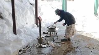 Happy life of an elderly couple in a village far from the city. The oldest type of needlework.