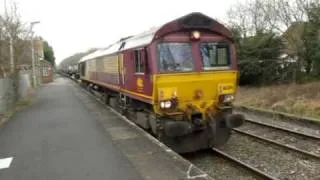 66204 departs Marchwood hauling a MOD train with a rake of army tanks 15/2/10