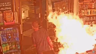 Surveillance video shows man pour bucket of gasoline in gas station store, set it on fire