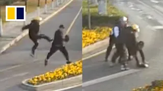 Delivery man and passer-by nab thief in dramatic chase