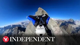 360-degree headcam captures stunning wingsuit jump from mountain in the Swiss Alps