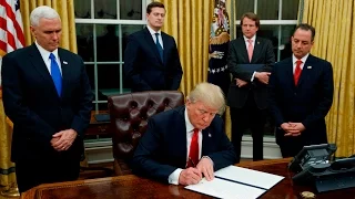 President Trump signs first executive orders
