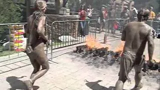 Melissa and Bobby jumping over fire at the Warrior Dash