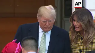 Trump and First Lady hand out Halloween candy to children at White House