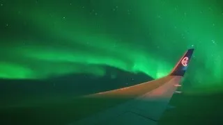 Watch as plane flies through Southern Lights