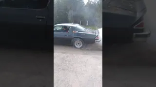 my dad in the 1976 camaro doing burnout