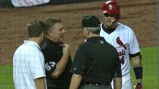 LAD@STL: Molina calls out trainer to check on umpire