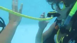 Sister SCUBA Divers Practice Rescue Breathing