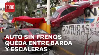 Auto sin frenos pierde el control y queda atrapado entre barda y escaleras - Las Noticias