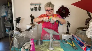 Applying the Head to a Fiber Clay Bird Sculpture