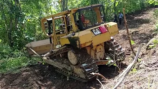 CAT D6R XL bulldozer working on widening plantation roads
