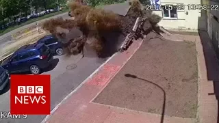 Dramatic Ukraine water pipe explosion captured on CCTV - BBC News