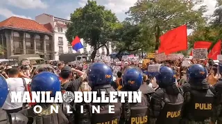 People flock in front of the COMELEC to protest an alleged mass cheating during the election 2022