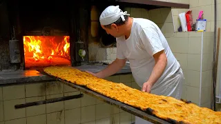 Two-meter long pizzas baked in a century-old wood-fired oven!