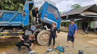 Mechanic girl repairs the car and replaces the air pipe for the turbo