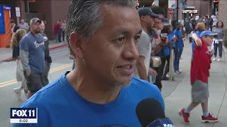 Dodger fans cheer on the Boys in Blue for Game 6 of NLCS