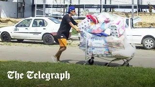 Hurricane Otis in Acapulco: 'Desperate' people loot warehouses in flooded Mexican city