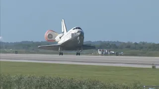 NASA- "Welcome Back!" Discovery Lands Safely at Kennedy