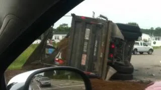 Dump truck crushes mini van in a rollover crash