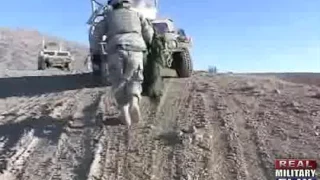 U.S. Army soldiers receive a C-130 Hercules cargo delivery airdrop