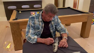 Sylvester Stallone Autographing "RAMBO" LAST BLOOD Heartstopper knifes For AuthenticSigningsInc.com