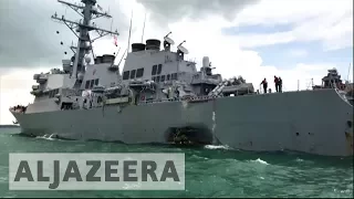 Sailors missing after US destroyer collides with oil tanker