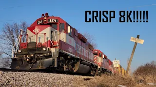 L595 blasts past an old Milwaukee Road STATION ONE MILE sign [8K]