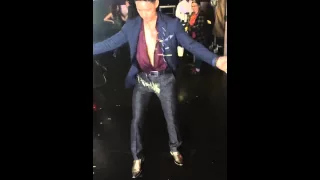 Harry Shum Jr dancing while in costume as Magnus Bane.