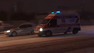 Ford Transit private ambulance responding code 3 during snowfall