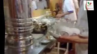 Iranian man serves tea in a tea-house in Iran